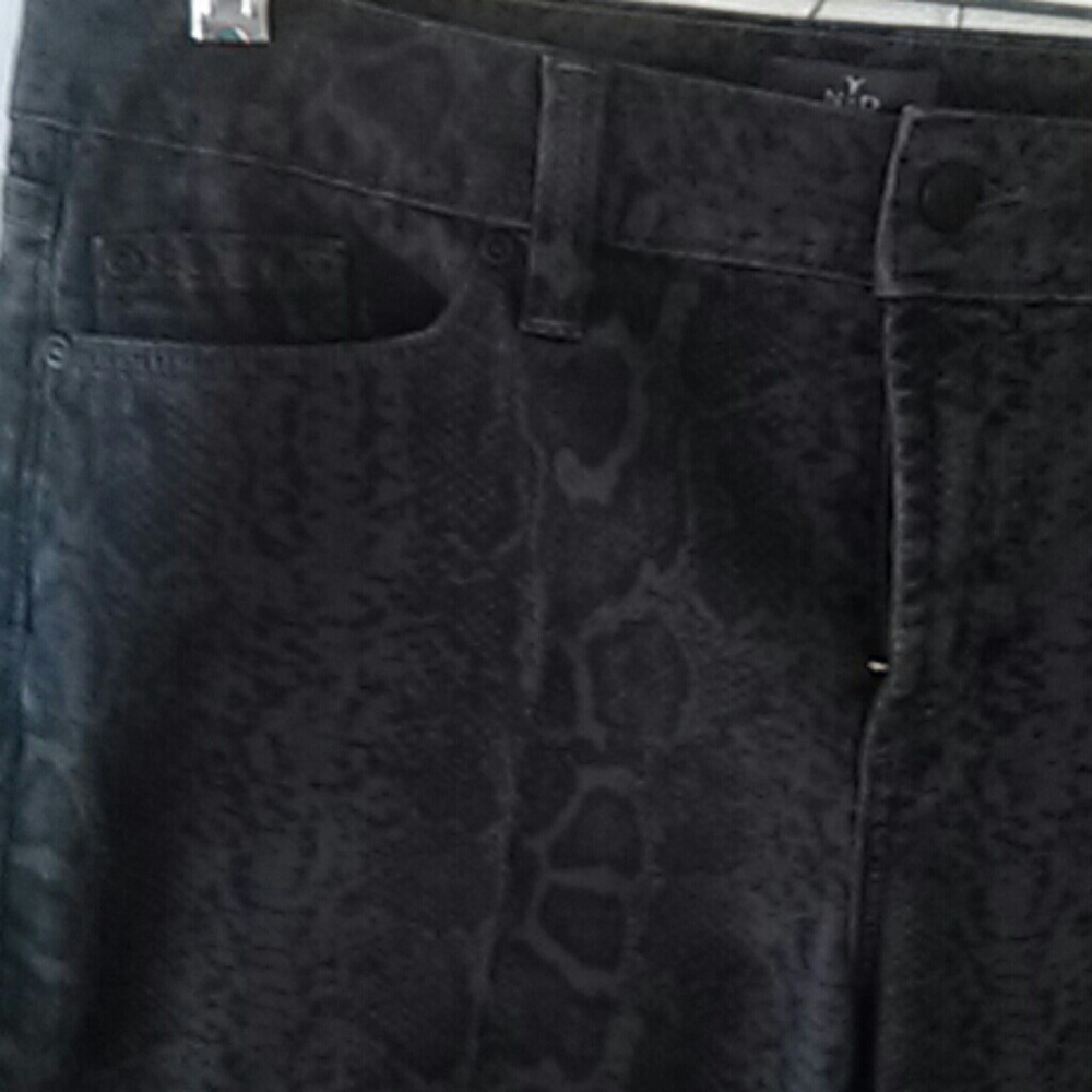 Black NYDJ leopard print skinny jeans.